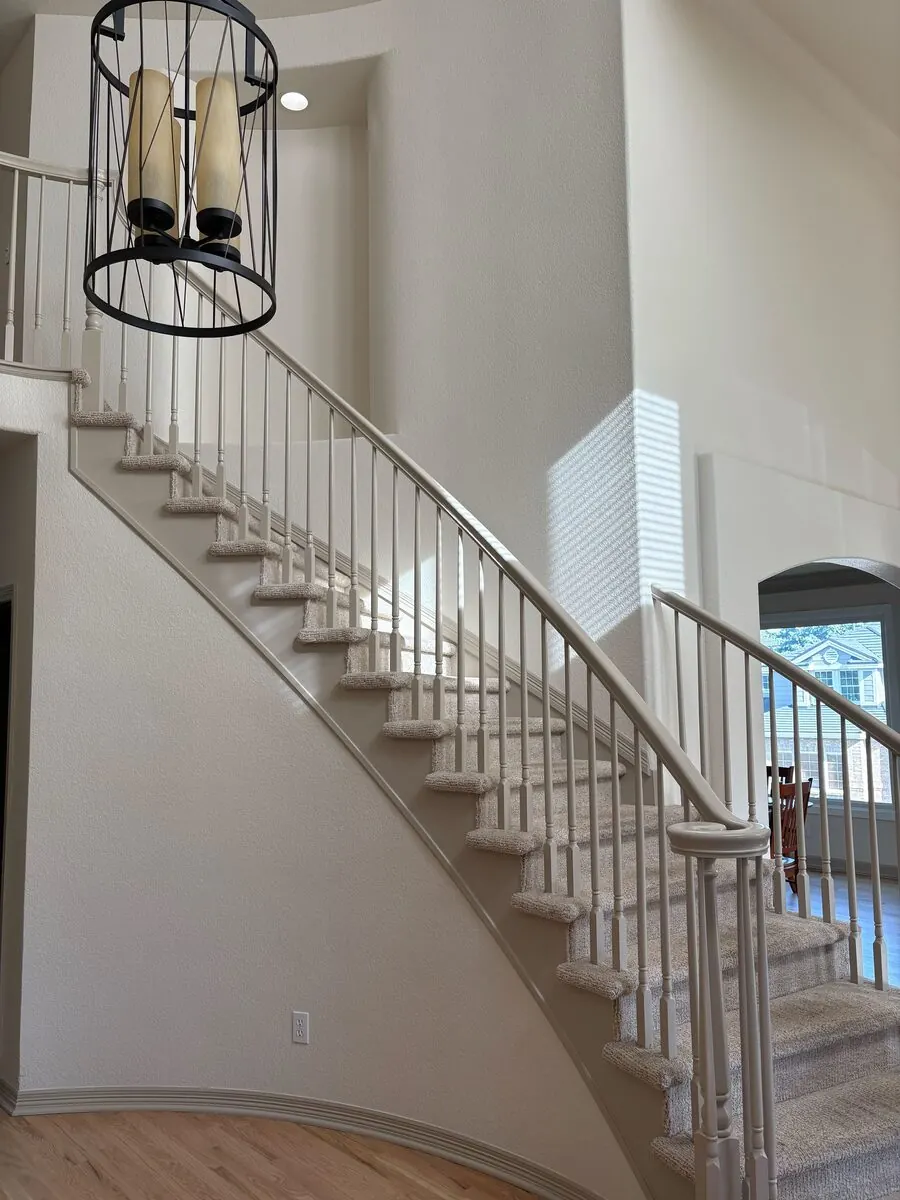 Freshly painted stairwell by Kind Home Painting